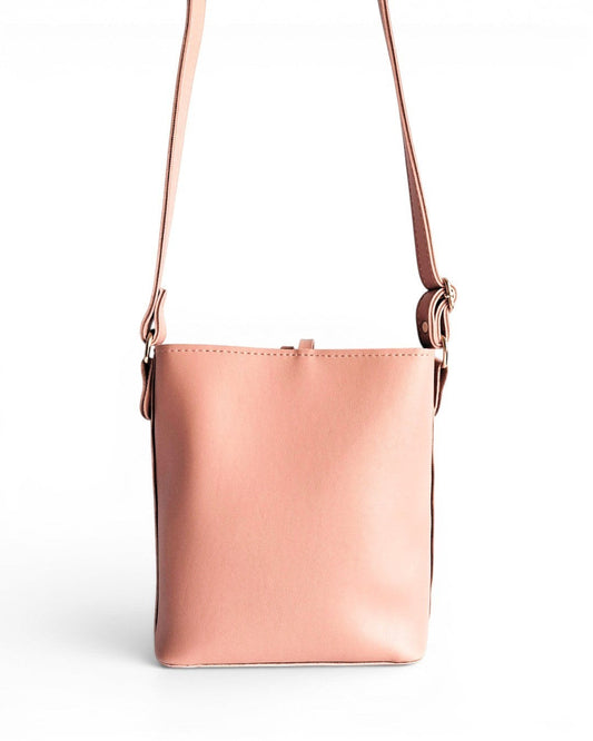 ms ADAM pink faux leather bucket shoulder bag with a zip closure and adjustable strap.