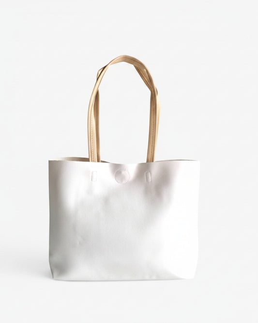 ms ADAM white faux leather minimalist tote bag with cream shoulder straps and magnetic snap closure.