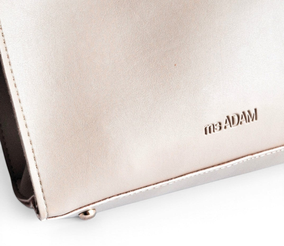 ms ADAM beige faux leather tote bag with two compartments and zip closure. Detachable strap for shoulder or handheld carry.