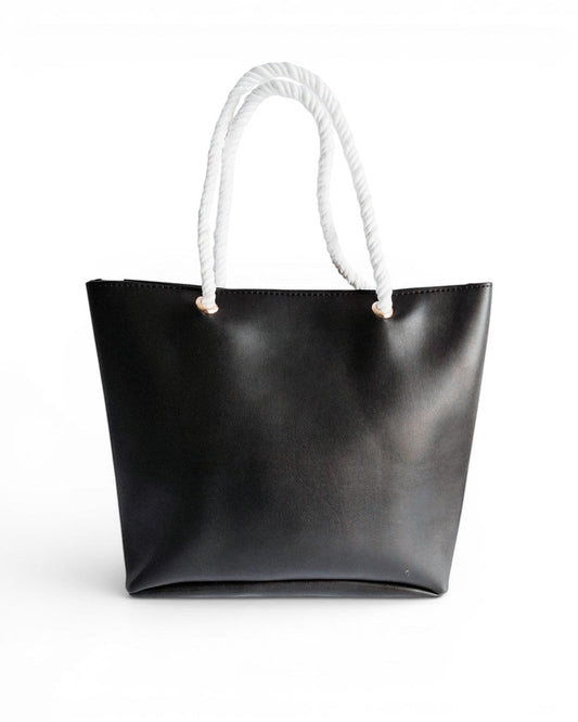 ms ADAM Oftyn black faux leather tote bag with white rope handles and zip closure. One main compartment.