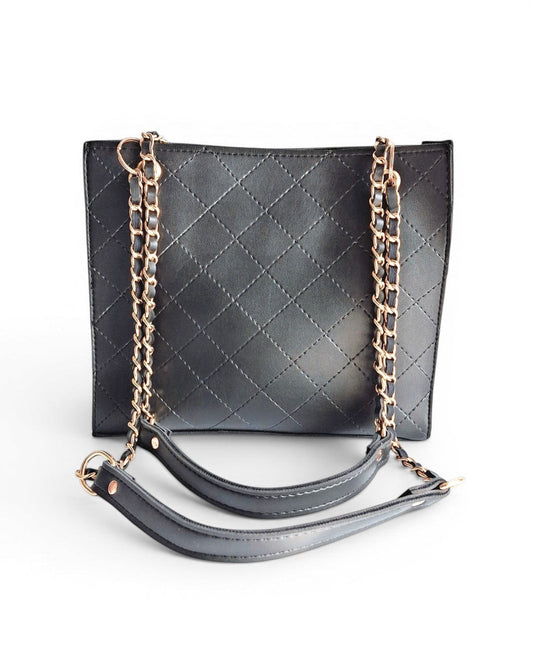 ms ADAM black faux leather quilted tote bag with gold chain straps and zip closure.