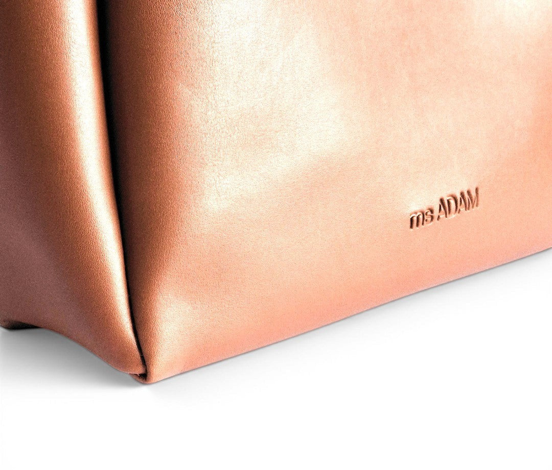 ms ADAM brown faux leather tote bag with fixed shoulder straps and zip closure. Unadorned texture.