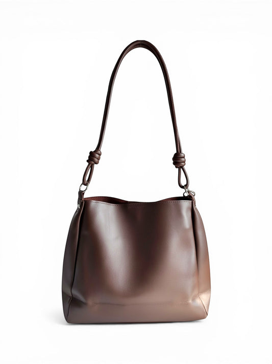 ms ADAM C Bean shoulder bag in coffee brown faux leather with magnetic snap closure and knotted strap detail.