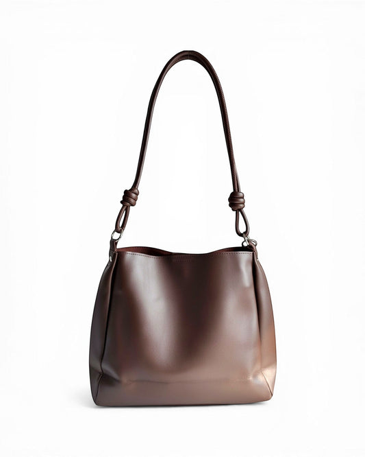ms ADAM C Bean shoulder bag in coffee brown faux leather with magnetic snap closure and knotted strap detail.