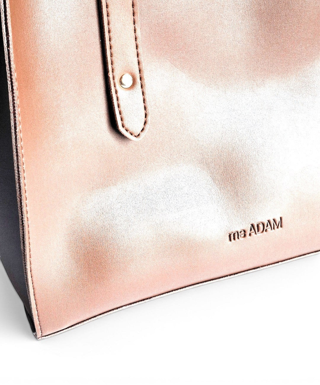 ms ADAM rose gold faux leather tote bag with fixed shoulder straps and zip closure.