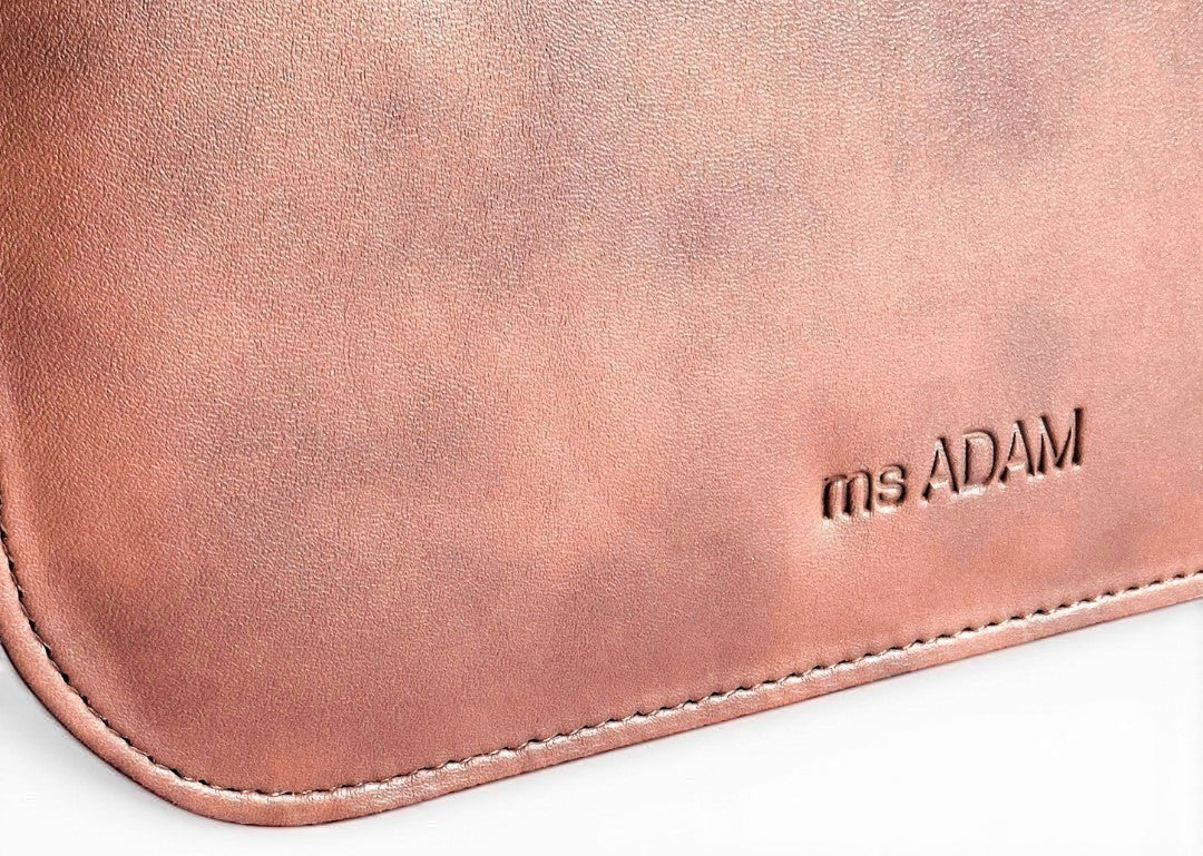 ms ADAM Urban Ease brown faux leather top handle bag with self-print texture and zip closure.