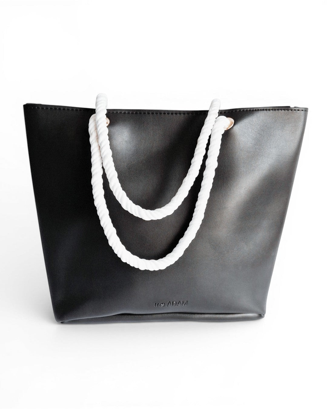 Ms. Adam black faux leather tote bag with white rope handles and zip closure. One main compartment.