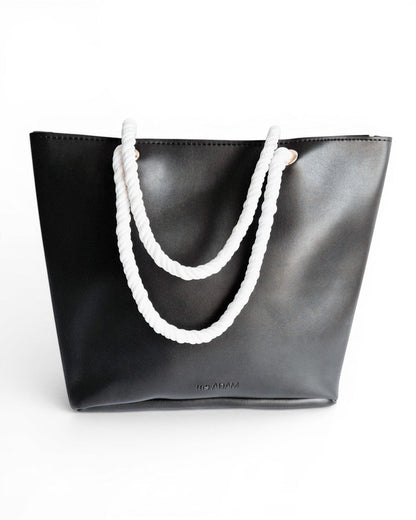 Ms. Adam black faux leather tote bag with white rope handles and zip closure. One main compartment.