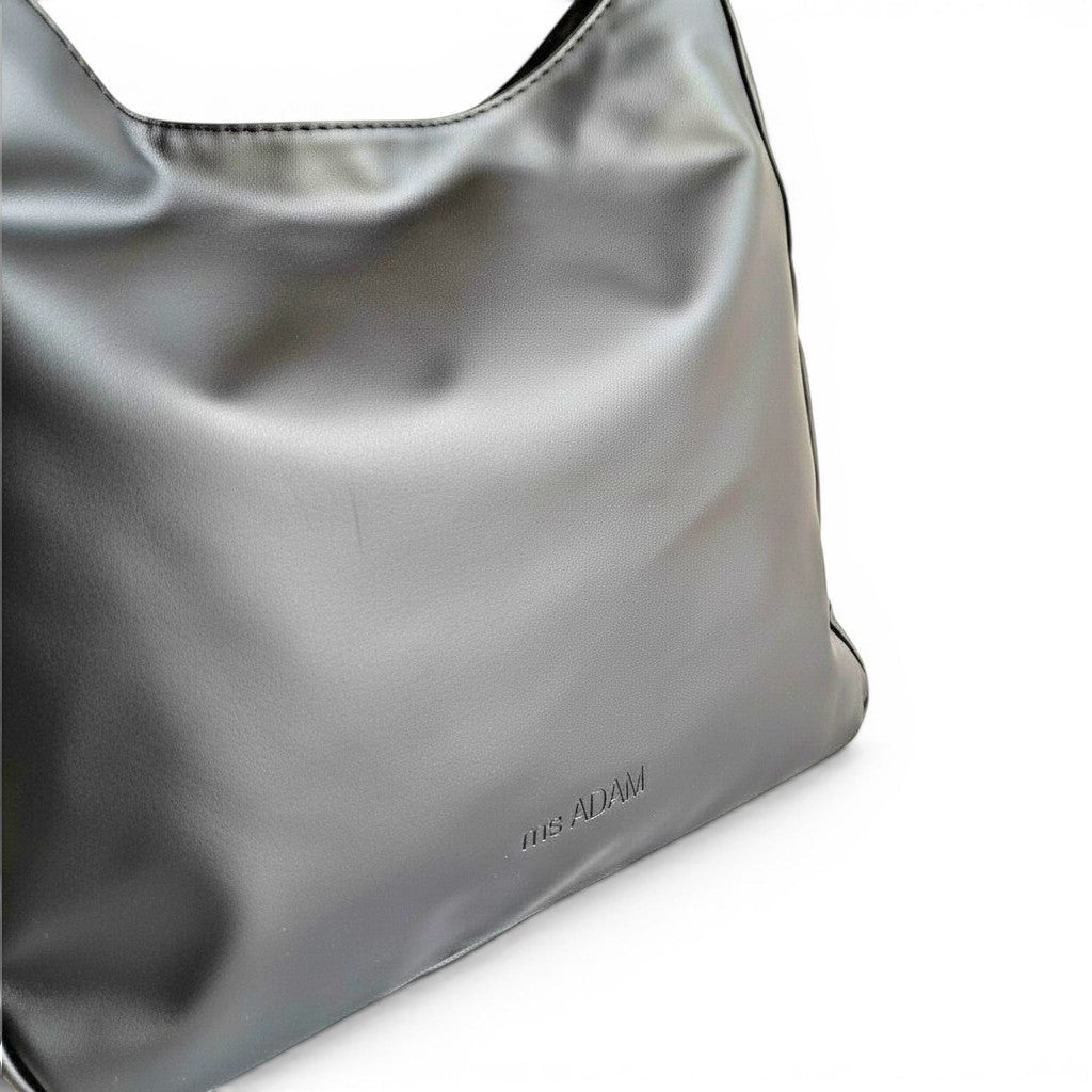 ms ADAM black PU leather unadorned shoulder bag with magnetic snap closure and one main compartment.