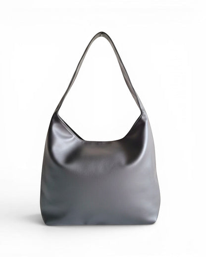 ms ADAM black PU leather vintage shoulder bag with magnetic snap closure and one main compartment.