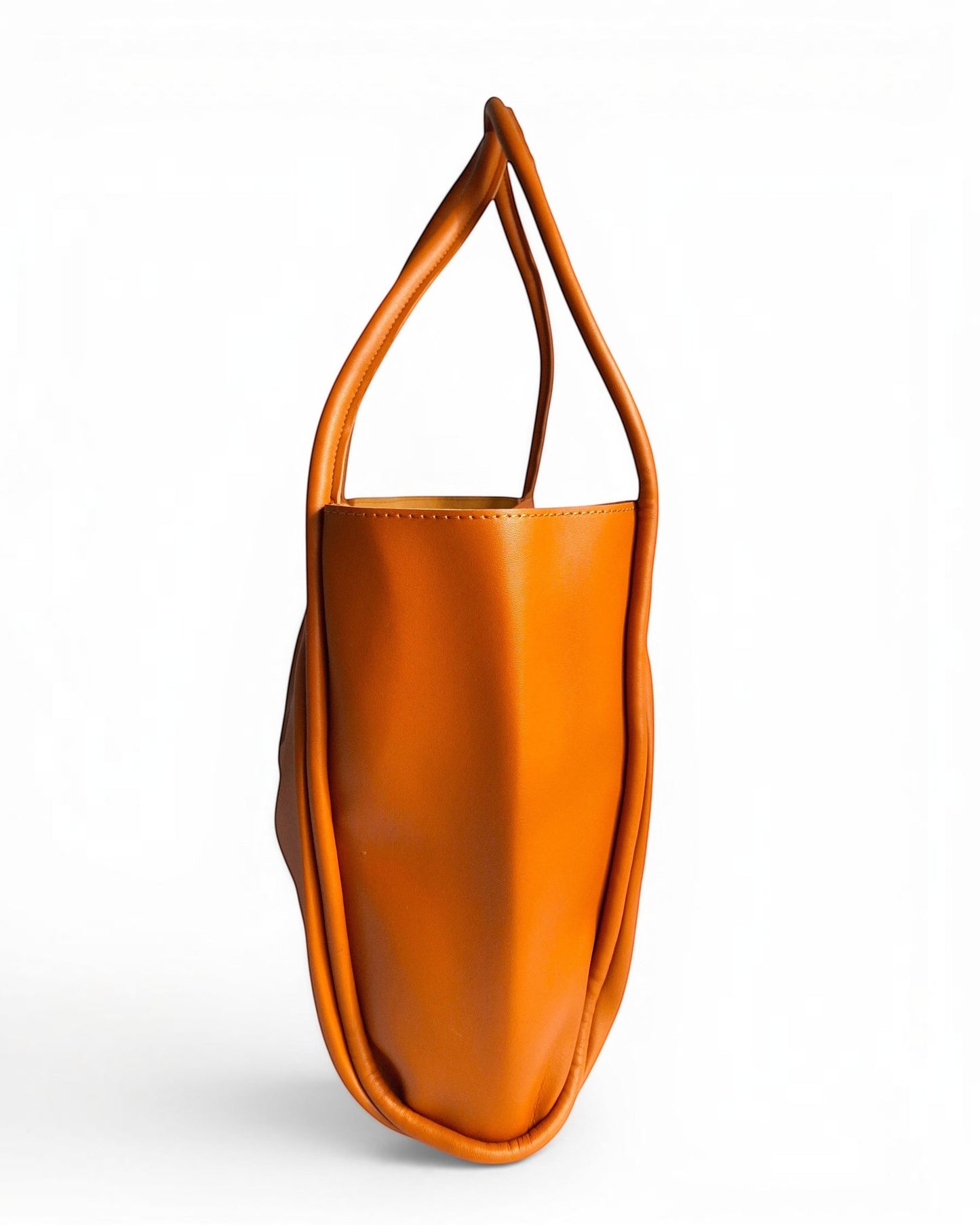 ms ADAM brown faux leather tote bag with shoulder straps and magnetic snap closure. Spacious interior with one main compartment.