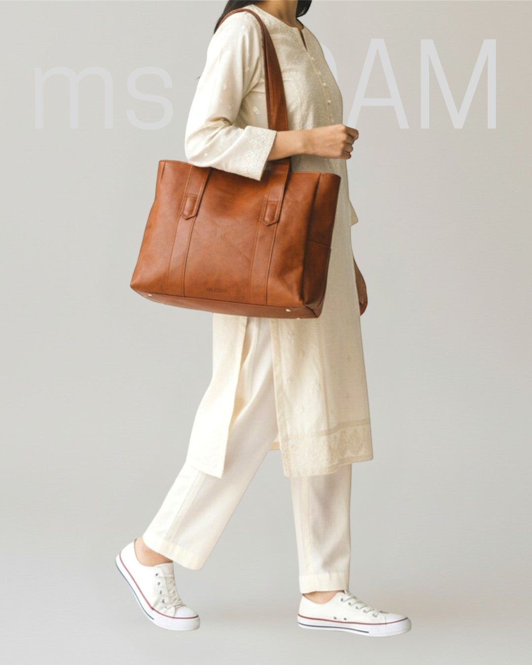 ms ADAM brown PU leather tote bag with shoulder straps and zip closure, large enough for laptops and documents.