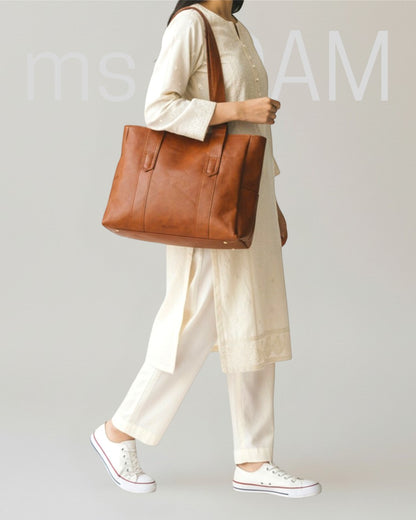 ms ADAM brown PU leather tote bag with shoulder straps and zip closure, large enough for laptops and documents.