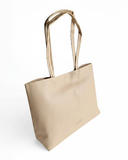 ms ADAM minimalist beige faux leather tote bag with cream straps, magnetic snap closure, and embossed logo.