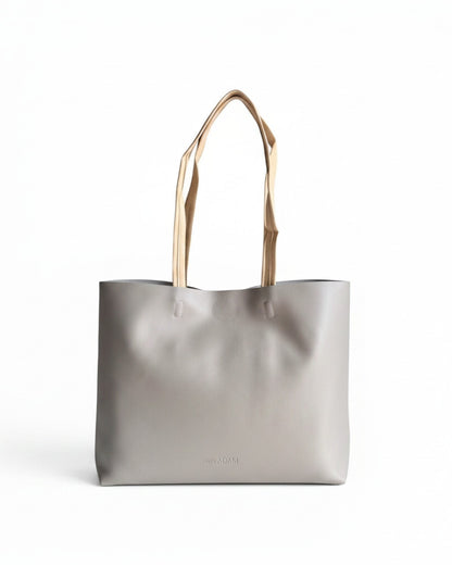 ms ADAM minimalist stone gray faux leather tote bag with contrast tan straps and magnetic snap closure.