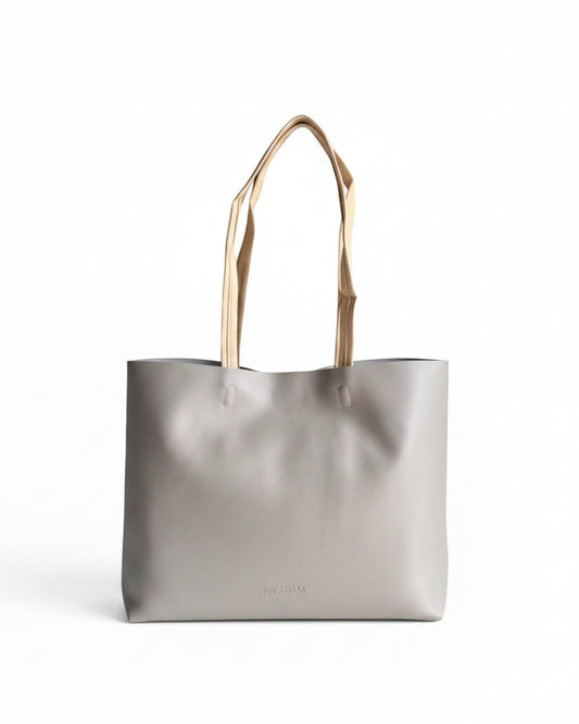 ms ADAM minimalist stone gray faux leather tote bag with contrast tan straps and magnetic snap closure.