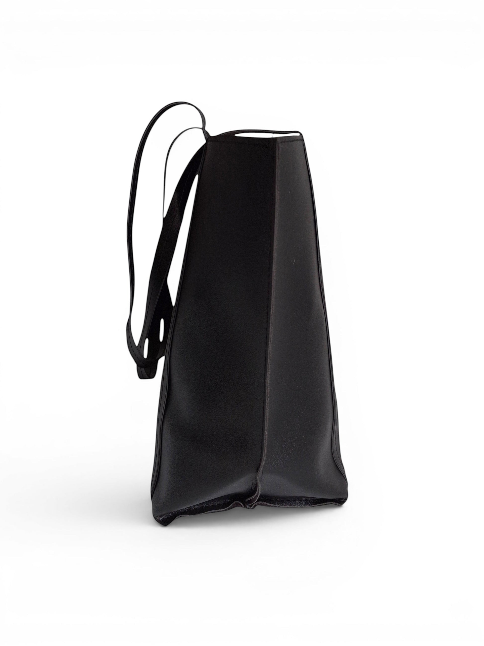 ms ADAM black faux leather tote bag with shoulder straps and magnetic snap closure.