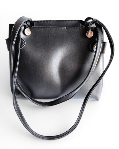 ms ADAM The Blow black faux leather tote bag with fixed shoulder straps and zip closure.