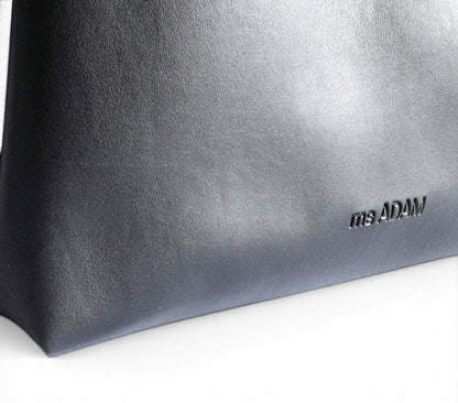 ms ADAM black faux leather tote bag with zip closure and one main compartment with pocket divider.