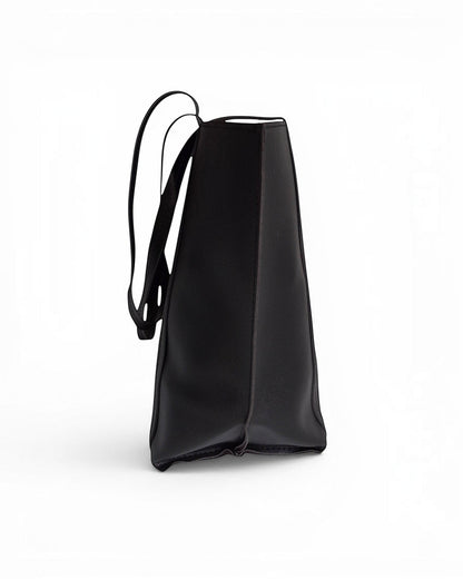 ms ADAM black faux leather tote bag with shoulder straps and magnetic snap closure.