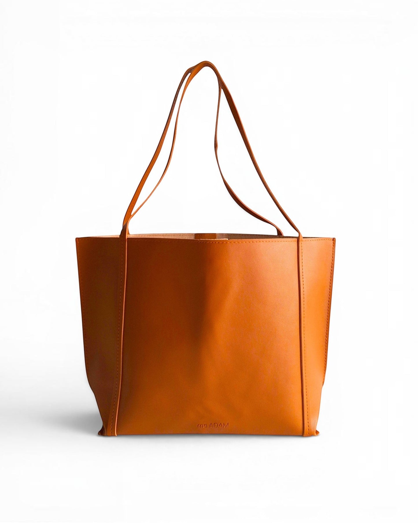 ms ADAM Go Easy Tote in brown faux leather with shoulder straps and a magnetic snap closure. Spacious and unadorned.