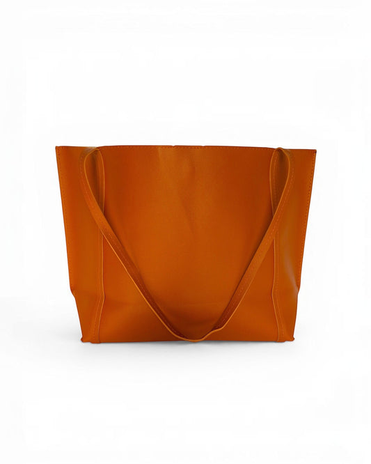 ms ADAM Go Easy Tote in rich brown faux leather. Spacious, unadorned design with shoulder straps and magnetic snap closure.