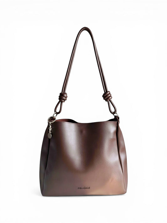 ms ADAM C Bean shoulder bag in coffee brown faux leather with magnetic snap closure and keychain charm.