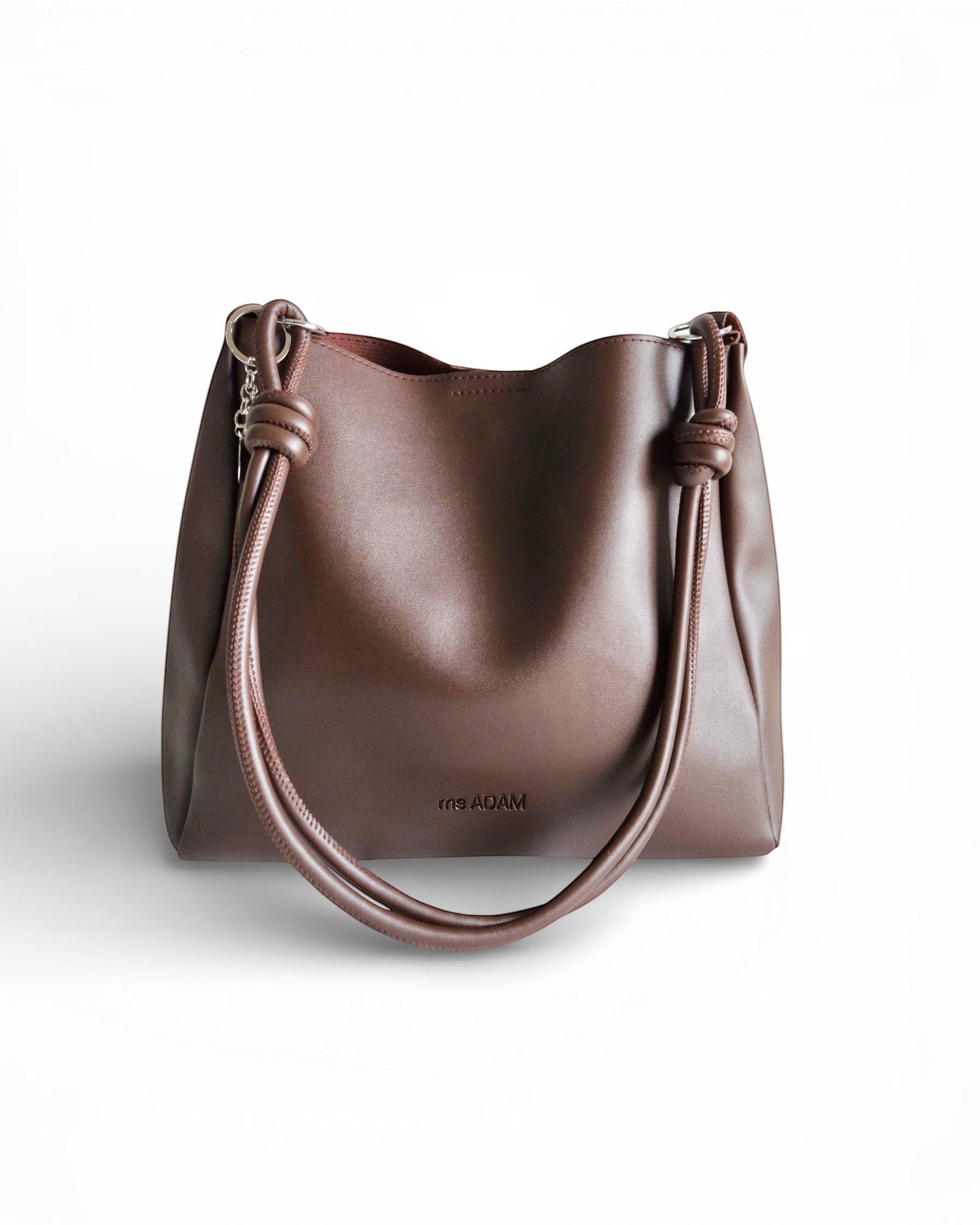 ms ADAM C Bean shoulder bag in coffee brown faux leather with knotted straps and magnetic snap closure.
