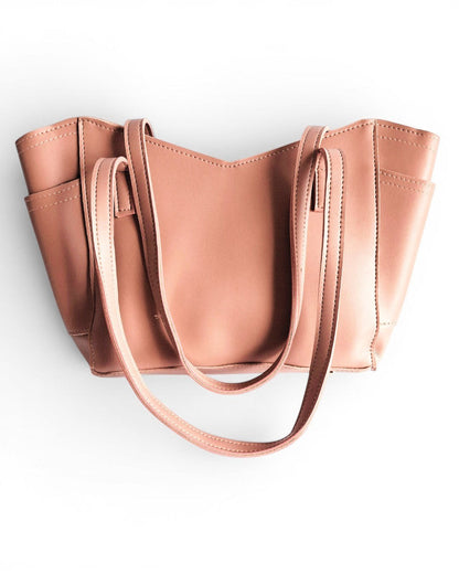 ms ADAM pink peach faux leather tote bag with shoulder straps and zip closure. Features one main compartment and exterior pockets.