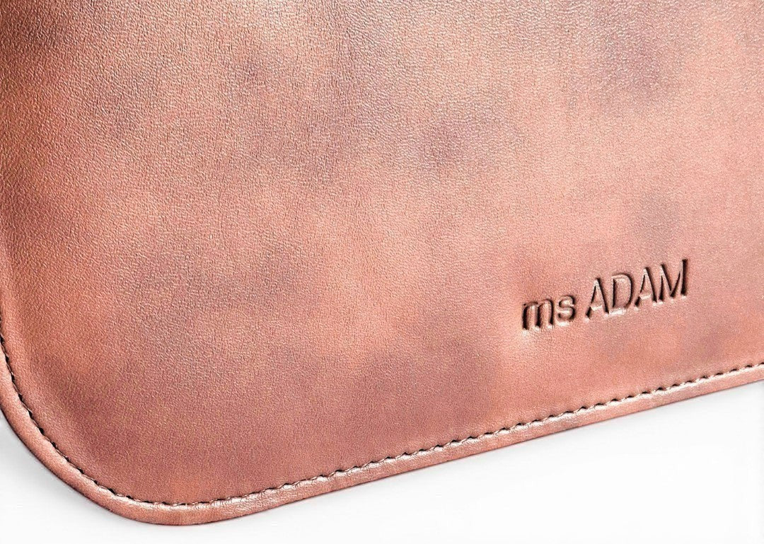 ms ADAM Urban Ease brown faux leather top handle bag with self-print texture and zip closure.